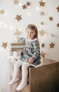 Little beautiful girl near the festive christmas tree Royalty Free Stock Photo