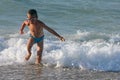 Little boy play with waves Royalty Free Stock Photo