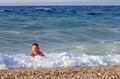 Little boy play with waves Royalty Free Stock Photo