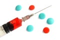 Stock Photo: Macro of a Syringe and Pills on a white background Royalty Free Stock Photo