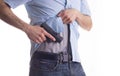 Man drawing concealed carry pistol