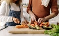 Couple preparing food in kitchen. Royalty Free Stock Photo