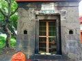 Stock photo of an old hindu temple made up of gray stones,Temple closed during covid period .