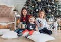 Portrait of three beautiful girls sisters in Christmas decorations Royalty Free Stock Photo