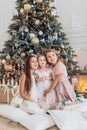 Portrait of three beautiful girls sisters in Christmas decorations Royalty Free Stock Photo