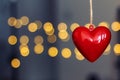 Stock photo of red plastic hearts hanging with an unfocused background Royalty Free Stock Photo