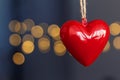 Stock photo of red plastic hearts hanging with an unfocused background Royalty Free Stock Photo