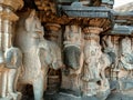 Stock photo of ruined ancient sculpture of Hindu trinity god sitting on elephant, idol carved out off gary color granite sunlight