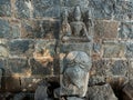 Stock photo of ruined ancient sculpture of Hindu trinity god sitting on elephant, idol carved out off gary color granite