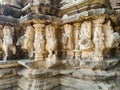 Stock photo of ruined ancient sculpture of Hindu trinity god sitting on elephant, idol carved out off gary color granite sunlight Royalty Free Stock Photo