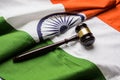 Stock photo showing Indian low and jurisdiction - Indian national flag or tricolour with wooden gavel showing concept of law in In