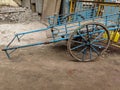 Stock photo of sky blue color old rusty bullock cart or hand cart parked outside of the go-down at Gandhinagar market area Royalty Free Stock Photo