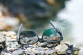 Stock Photo - Sunglasses by the rocks