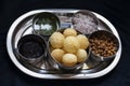 Stock photo of traditional famous Indian street snacks or food panipuri.it is also known as puchka, golgappa, spicy water ball. Royalty Free Stock Photo