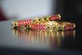 Stock photo of traditional Indian designer bangles or bracelet for women.precious red and green color stone decorated on bangles. Royalty Free Stock Photo