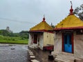 Stock photo of two ancient hindu temple of goddess Renuka devi, Temple building painted with light yellow color, roof painted with Royalty Free Stock Photo