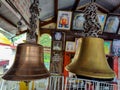 Stock photo of two anicnet big size copper or bronze metal bell hanging in the hindu temple on