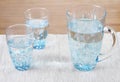Stock photo of two glasses and a pitcher of water