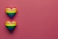 Stock photo of LGBT hearts on a red background with space for text