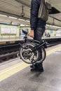 Man Carrying Detachable Bike