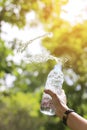 Stock Photo:Water Bottle with Water Splash in Hand Royalty Free Stock Photo