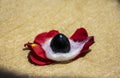 Stock photo of a worshiping black stone shivling which is icon of lord shiva on the occasion of mahashivratri , flowers around the