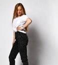 Stock photo of young, fit and sexy woman in jeans and white top isolated on white Royalty Free Stock Photo