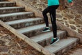 Stock photo of a young woman climbing stairs while running Royalty Free Stock Photo