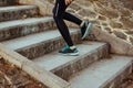 Stock photo of a young woman climbing stairs while running Royalty Free Stock Photo