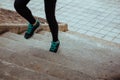 Stock photo of a young woman climbing stairs while running Royalty Free Stock Photo