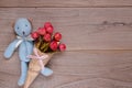 Stock photography flat lay plank table template blue bear doll holding rose flower Royalty Free Stock Photo