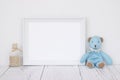 Stock photography white frame vintage painted wood table cute blue bear glass bottle with sand inside