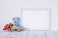 Stock photography white frame vintage painted wood table cute blue bear holding rose flower