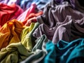 stock picture of print manufacturer, showing stock of muted colorful blank tshirts.