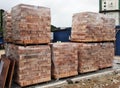 Stock pile of clay brick on wooden pallets stacked at the construction site. Royalty Free Stock Photo