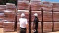 Stock pile of clay brick on wooden pallets stacked at the construction site. Royalty Free Stock Photo