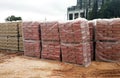 Stock pile of portland cement in commercial bags.