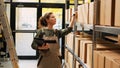 Stock room employee scanning barcodes