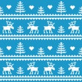 Stock . Seamless fabric.Merry Christmas and happy New year. Elk. Tree. Pixels. White and blue color. Royalty Free Stock Photo