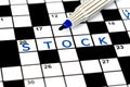 Stock in solving crossword puzzle Royalty Free Stock Photo