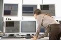 Stock Trader Examining Computer Monitors