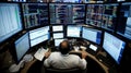 A Stock Trader Surrounded by Multiple Computer Monitors Displaying Stock Market Data Royalty Free Stock Photo
