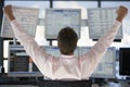 Stock Trader Watching Computer Screens With Hands Raised Royalty Free Stock Photo