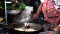 Stock Video Footage hdv Cooking Thai food outdoors, fried boiling oil, pies