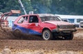 Stockcar drives on a dirty track at a Stockcar challenge. Royalty Free Stock Photo