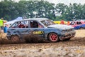 Stockcar drives on a dirty track at a Stockcar challenge. Royalty Free Stock Photo