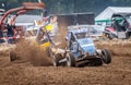 Stockcar drives on a dirty track at a Stockcar challenge. Royalty Free Stock Photo