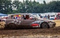 Stockcar drives on a dirty track at a Stockcar challenge. Royalty Free Stock Photo