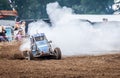 Stockcar drives on a dirty track at a Stockcar challenge. Royalty Free Stock Photo