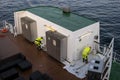 Stockholm, Sweden - April 29, 2019: Repair work on the passenger ferry of the Viking line. Workers paint the ship`s superstructur